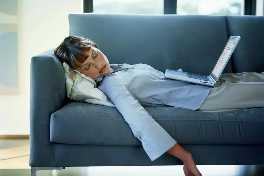 Person experiencing fatigue and low energy at home in St. Louis