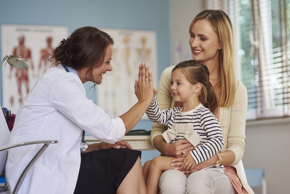 St. Louis parent and child completing a back-to-school health check with a primary care physician.