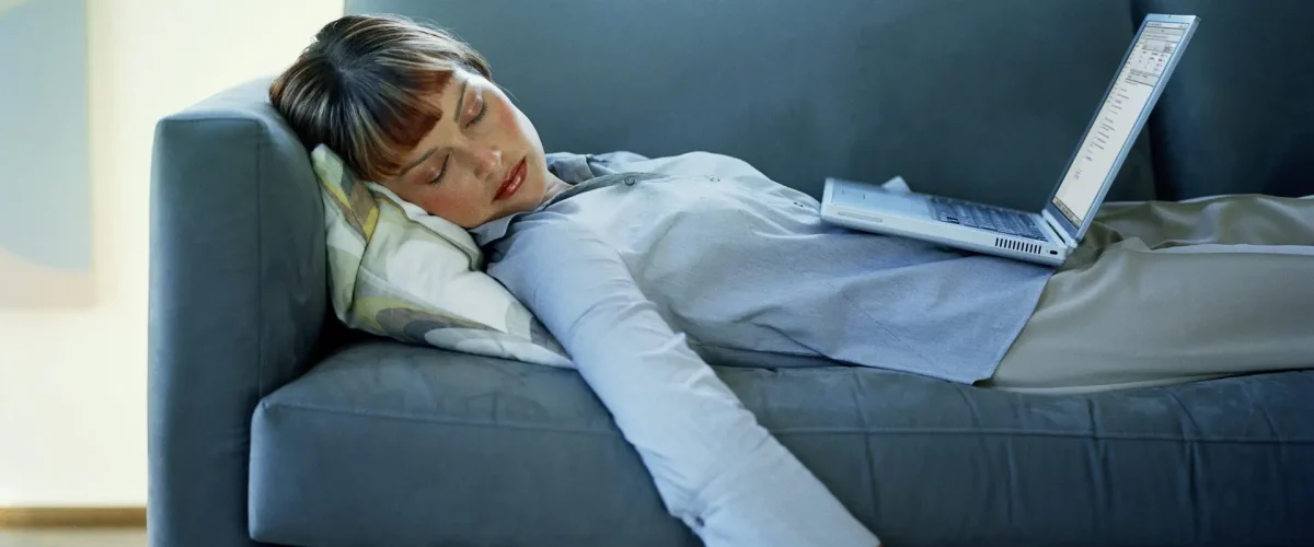 Person experiencing fatigue and low energy at home in St. Louis