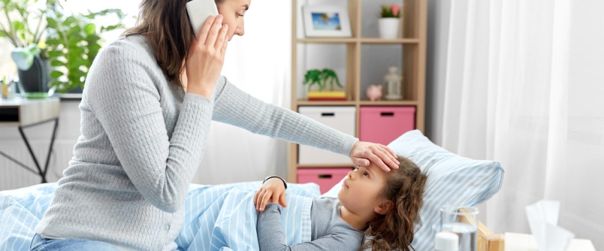 mother calling doctor with sick daughter