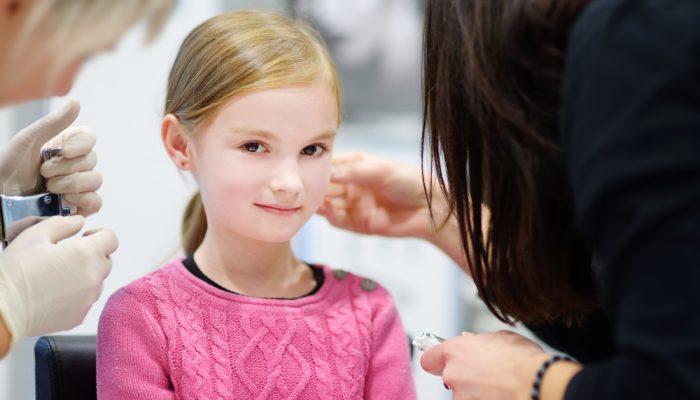 Little Girl Having Ear Piercing